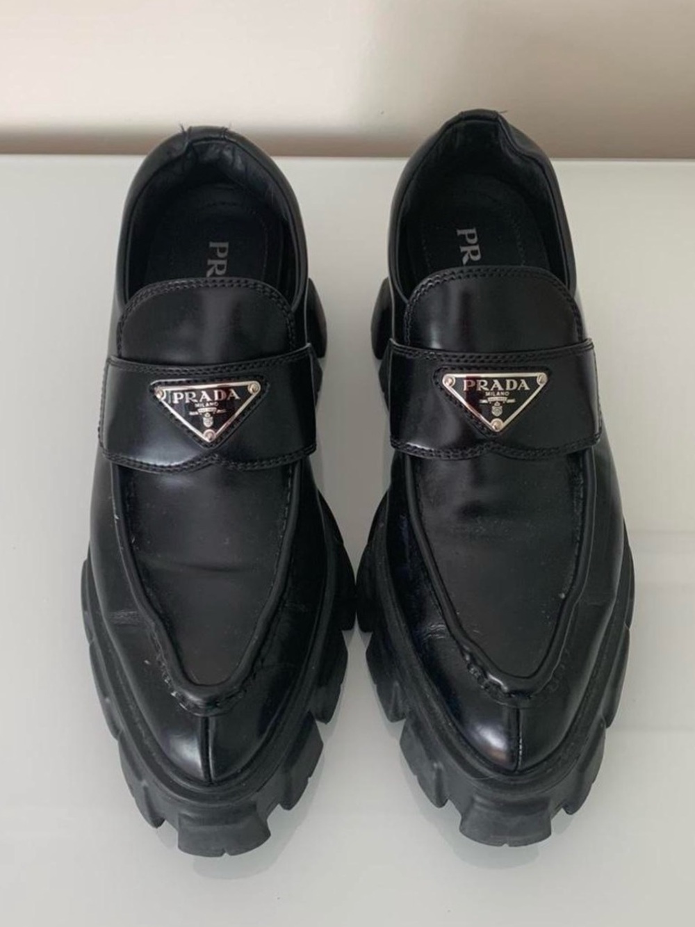 Prada Black Leather Lug-Sole Slip-On Loafers with Logo Plaque